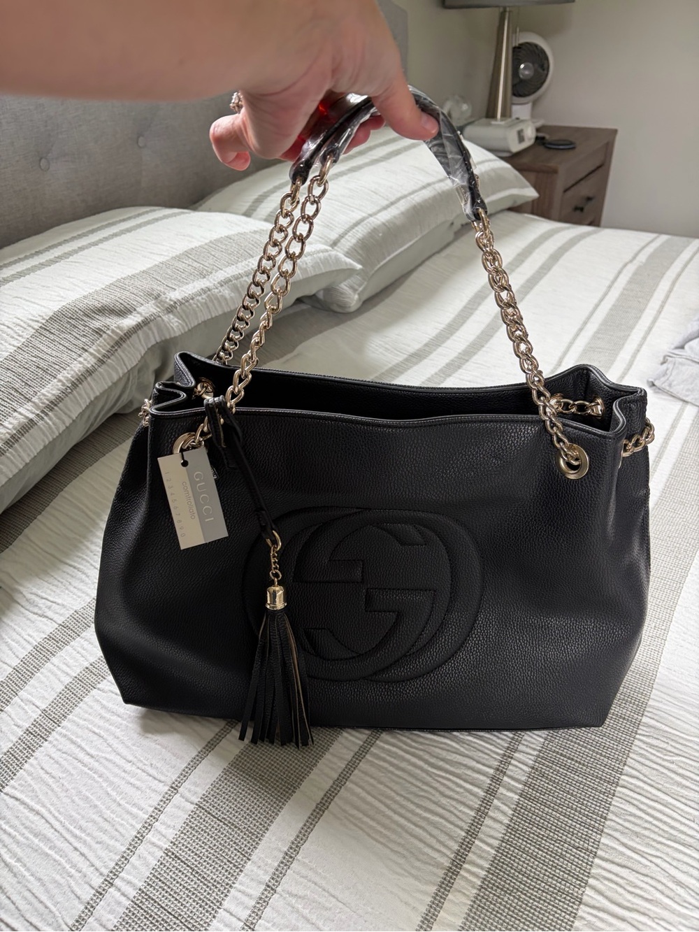 Black Leather Shoulder Bag with Gold Chain and Tassel